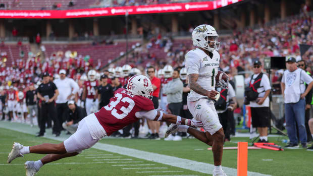 Sep 16, 2023; Stanford, California, USA; Sacramento State Hornets quarterback Kaiden Bennett (1) runs for a touchdown past Stanford Cardinal safety Alaka'i Gilman (33) during the second quarter at Stanford Stadium. Mandatory Credit: Sergio Estrada-USA TODAY Sports